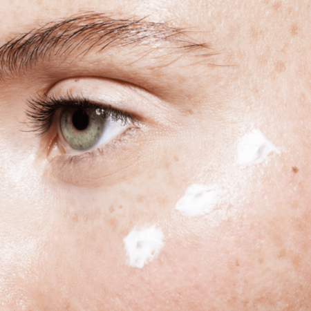Woman applies Eyeliss eye cream