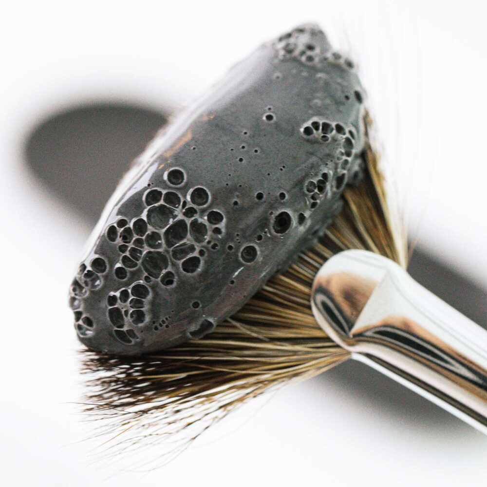 Activated charcoal mask on brush